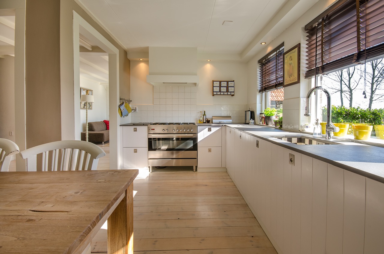 large open concept kitchen with an L shaped counter top 